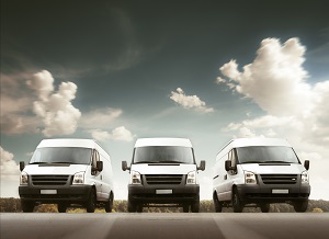 3 white commercial vans