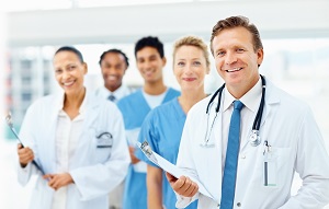 group of doctors and nurses smiling at camera